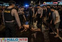Ilustrasi foto terduga pelaku pencurian yang diamuk massa di Dusun Mapak Reong, Desa Kuranji Dalang, Kecamatan Labuapi, Lombok Barat. (Foto: AI).