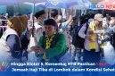 Sejumlah petugas PPIH Embarkasi Lombok menggunakan payung saat menyambut dan bersalaman dengan jemaah haji kloter 5 asal Mataram yang baru tiba di Asrama Haji Mataram, NTB, Minggu (7/6/2026). (Foto: Istimewa)