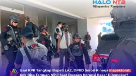 Personel Brimob Polda NTB mengawal tim penyidik Komisi Pemberantasan Korupsi (KPK) saat melakukan penggeledahan di Kantor Bupati Lombok Barat, terkait pengumpulan barang bukti dokumen dalam kasus dugaan korupsi yang menjerat Bupati Lombok Barat.(Foto: Istimewa)