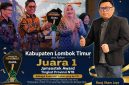 Bupati Lombok Timur H. Haerul Warisin (tengah) menerima penghargaan Juara 1 Jamsostek Award Tingkat Provinsi NTB 2026. Ketua LP3M Muara Kasih Lotim, Bang Ilham Jaya (kanan), memberikan apresiasi atas prestasi tersebut.