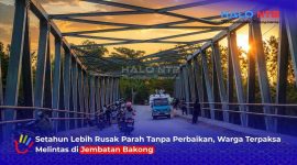 Tampak kondisi Jembatan Bakong yang menghubungkan Desa Kebon Ayu dan Desa Lembar Indah di Kecamatan Lembar dan Gerung, Lombok Barat, masih rusak parah lebih dari satu tahun pasca diterjang banjir bandang awal 2025.(Foto: Halo NTB)